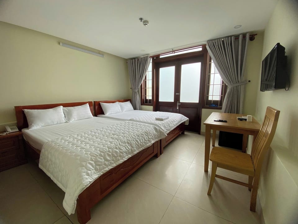 Family Room, City View | Hypo-allergenic bedding, memory foam beds, minibar, desk