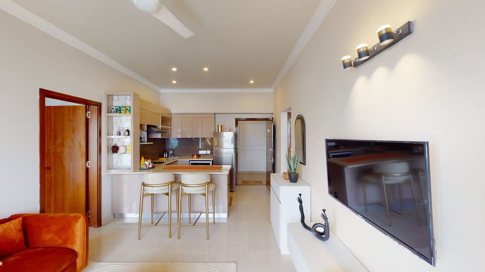 Deluxe Double Room | Living area | 56-inch Smart TV with digital channels, books, streaming services
