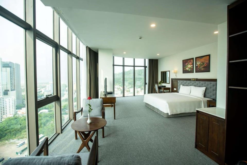 Deluxe Double Room | Minibar, in-room safe, laptop workspace, blackout drapes