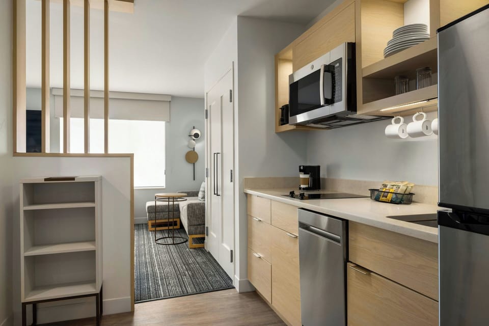 Desk, laptop workspace, iron/ironing board, free cribs/infant beds