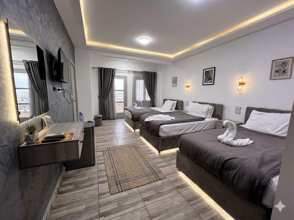 Quadruple Room, Balcony, City View | Soundproofing, free WiFi, bed sheets, wheelchair access