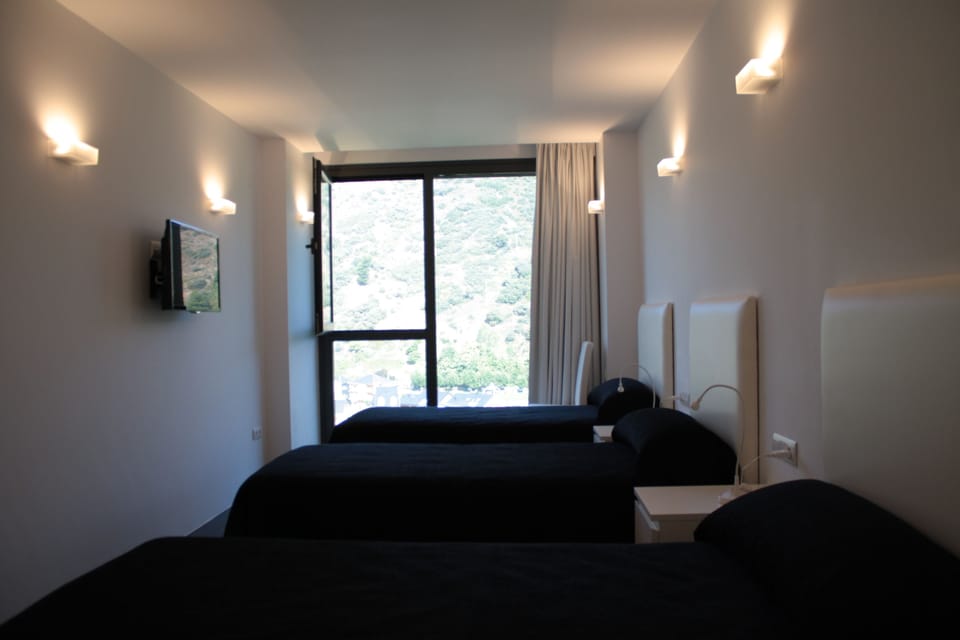 Triple Room | Premium bedding, blackout drapes, soundproofing, free wired internet