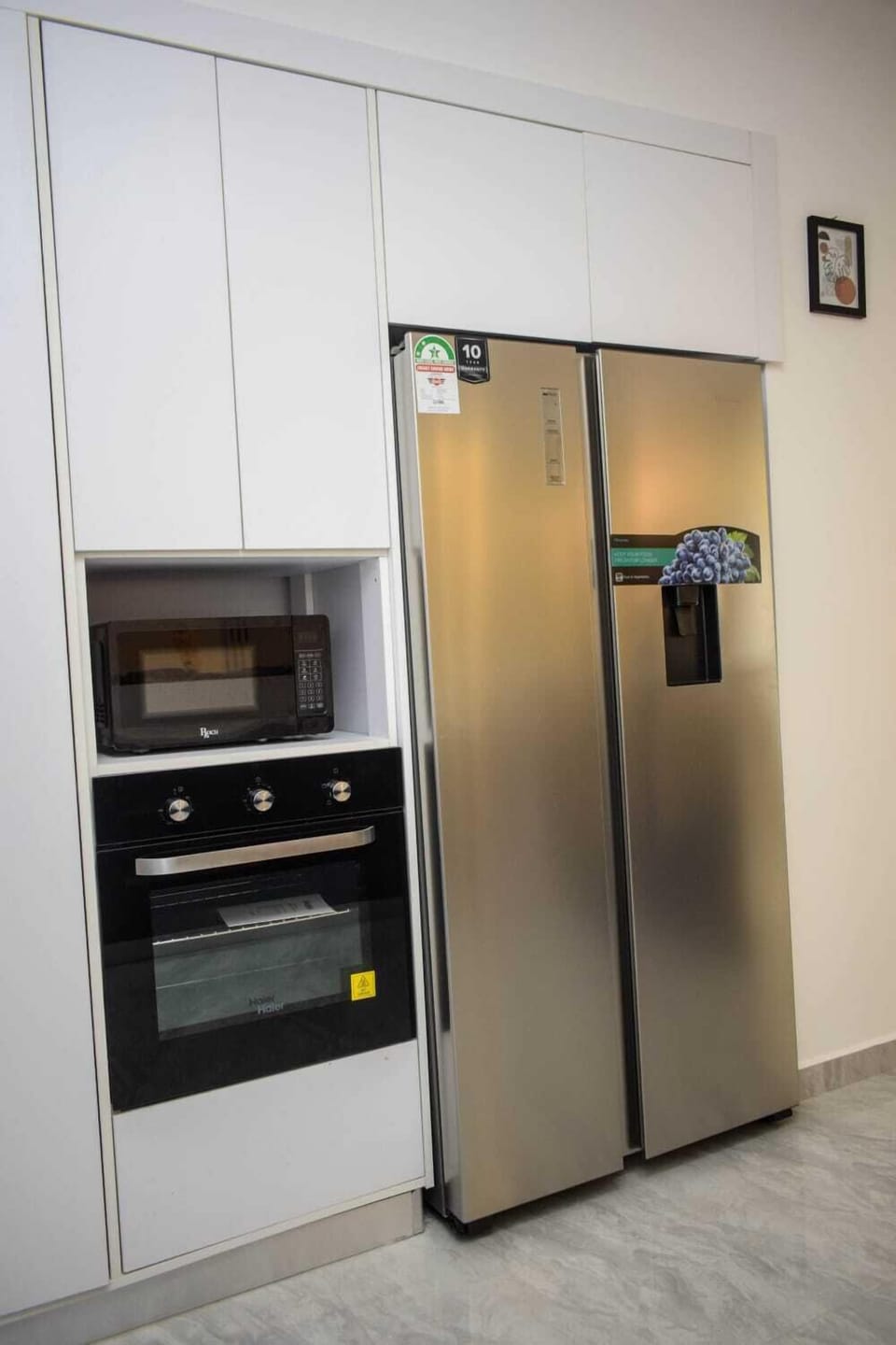 Family Apartment, Balcony, City View | Private kitchen | Fridge, microwave, cookware/dishes/utensils, dining tables