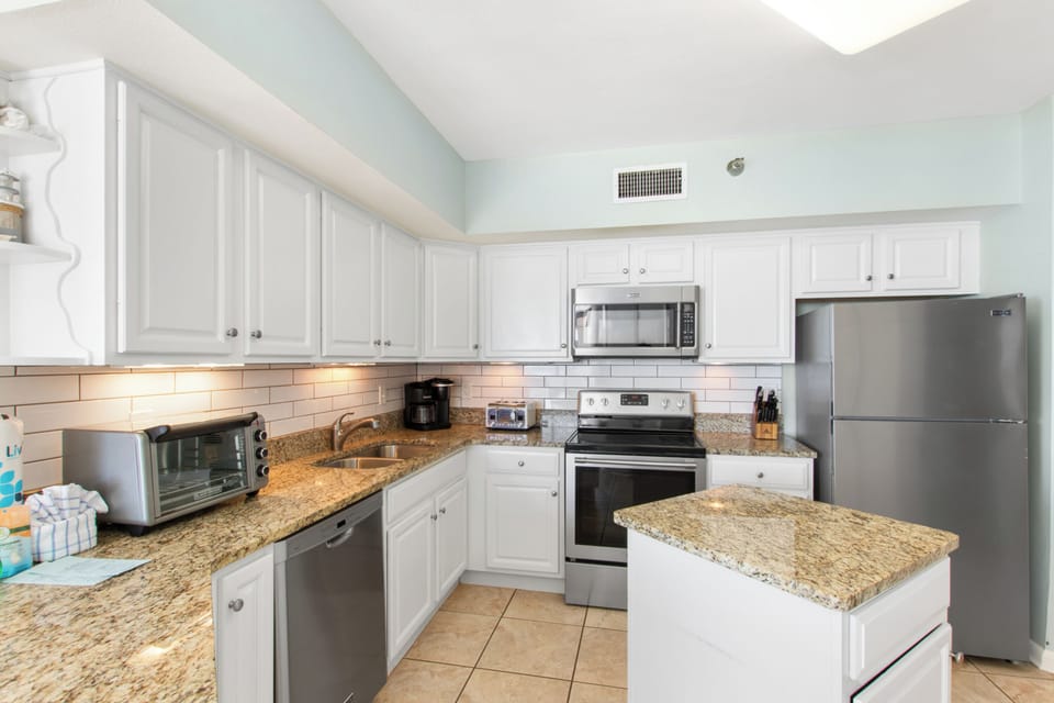 Signature Condo, Beach View | Private kitchen | Fridge, microwave, oven, stovetop