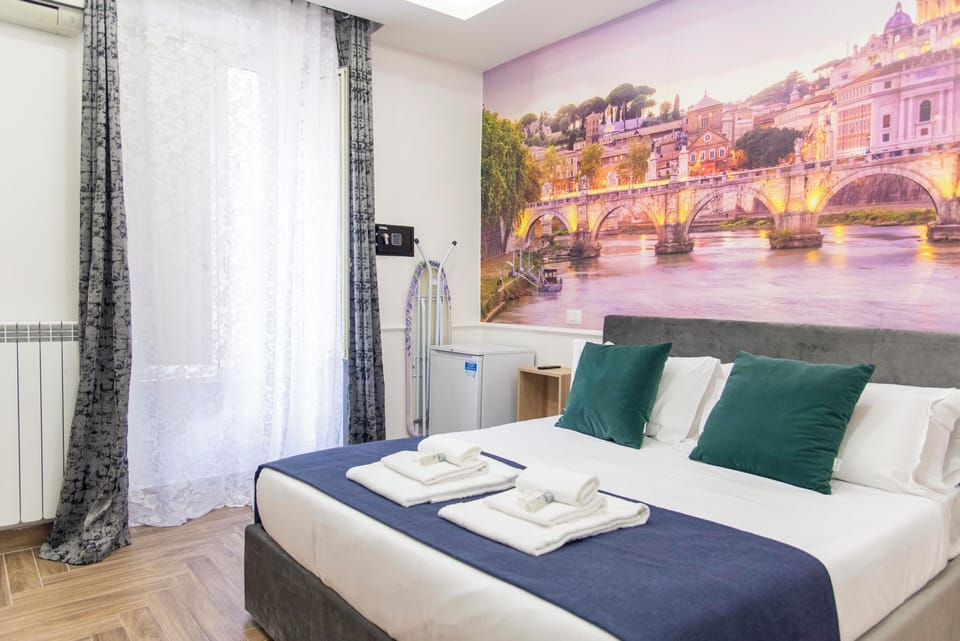 Room San Pietro, queen bed, AC/Heat, non-smoking, private bathroom | Desk, laptop workspace, blackout drapes, iron/ironing board