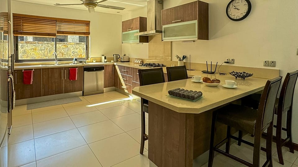 Family Apartment, Lagoon View | Private kitchen | Coffee/tea maker, electric kettle, highchair