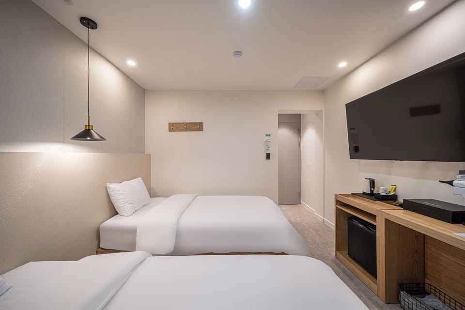 Twin Room, Multiple Beds, Non Smoking, Private Bathroom (Self Check-in) | Premium bedding, desk, laptop workspace, blackout drapes