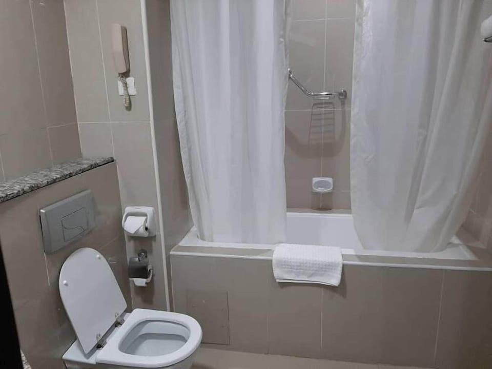 Deluxe Room, Balcony, City View | Bathroom | Free toiletries, hair dryer, towels, soap
