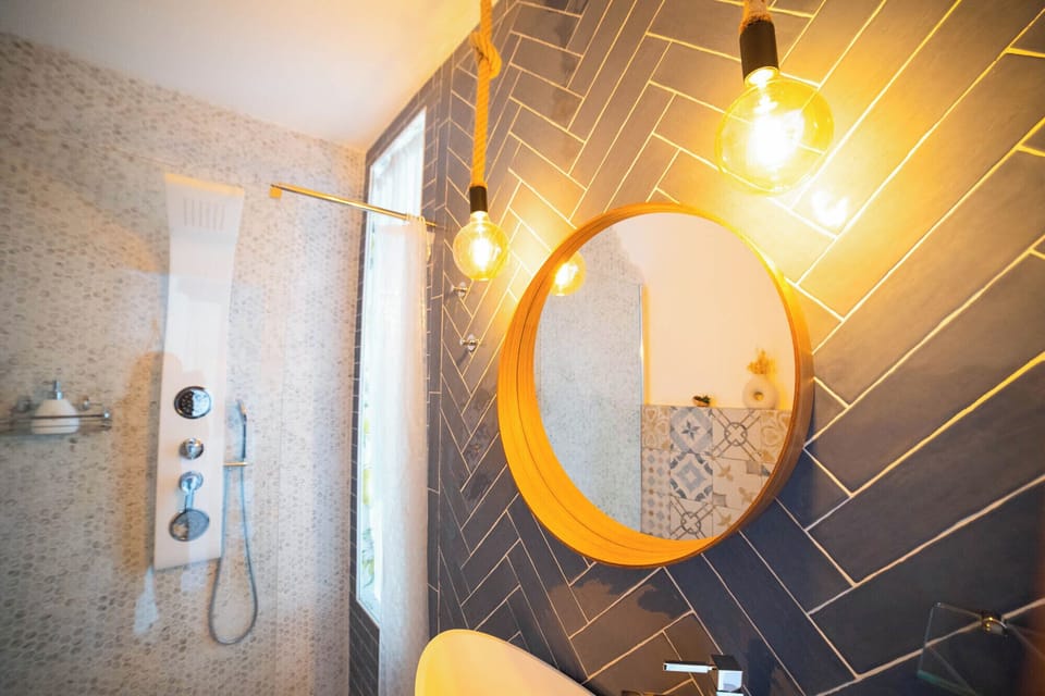 Deluxe Double Room, Mountain View | Bathroom | Hair dryer, bathrobes, towels, soap