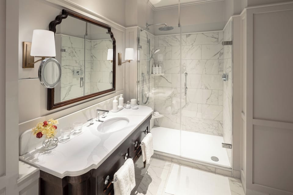 Shower, rainfall showerhead, designer toiletries, hair dryer