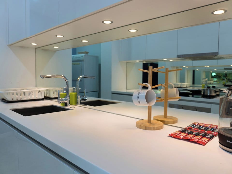 Two Bedrooms Apartment | Desk, blackout drapes, iron/ironing board, free rollaway beds
