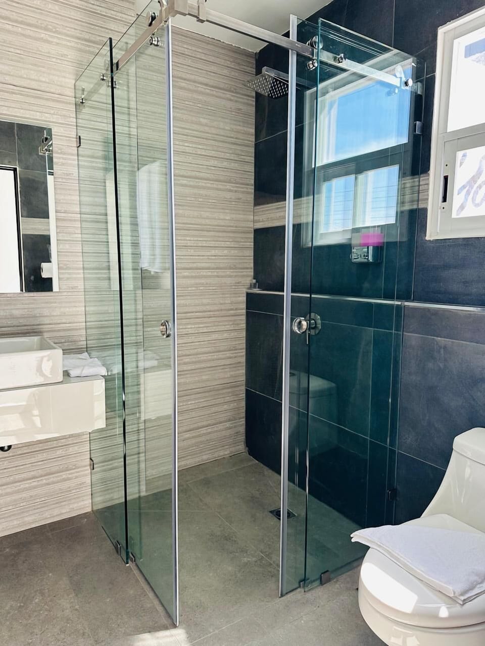 Shower, free toiletries, slippers, towels