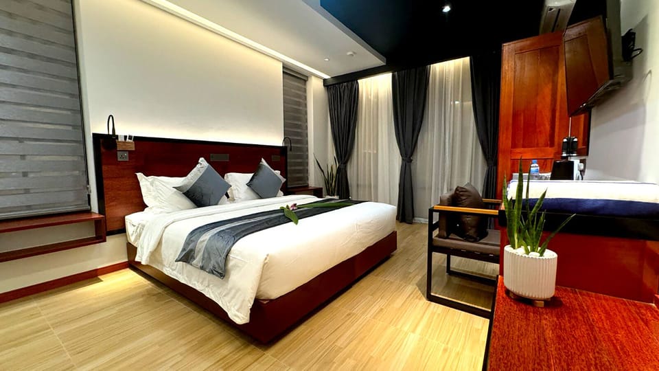 Deluxe Double or Twin Room, Balcony, City View | In-room safe, desk, laptop workspace, iron/ironing board