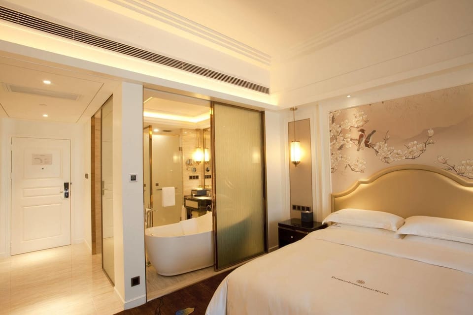 Premium bedding, down comforters, pillowtop beds, minibar