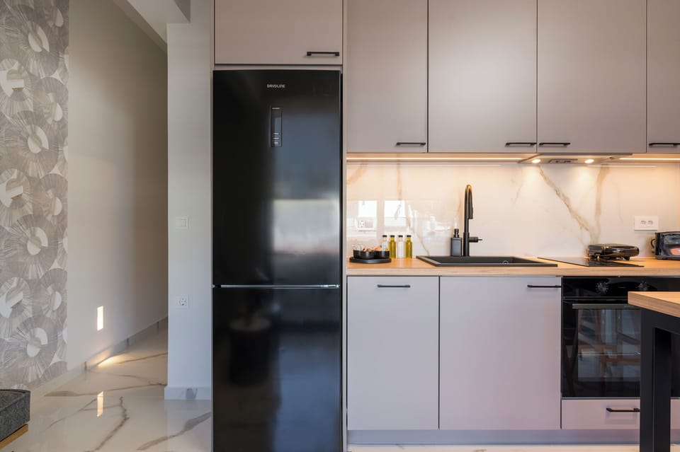 Deluxe Apartment, 2 Bedrooms, Beachside | Private kitchen | Oven, stovetop, electric kettle, toaster