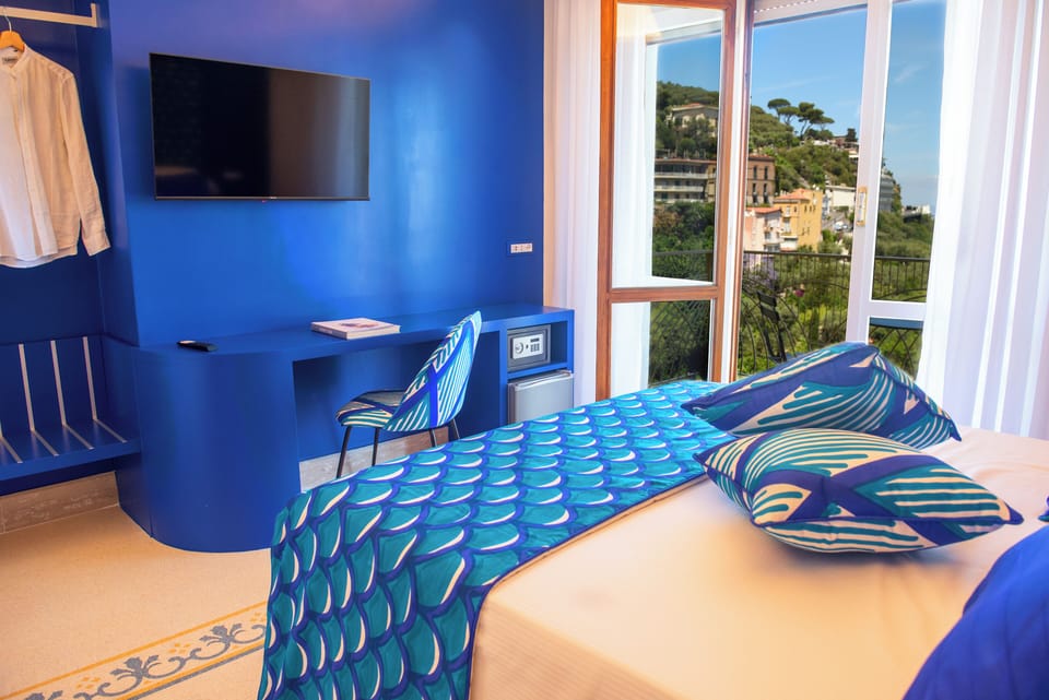 Panoramic Double Room, Balcony, Sea View | Minibar, in-room safe, desk, laptop workspace