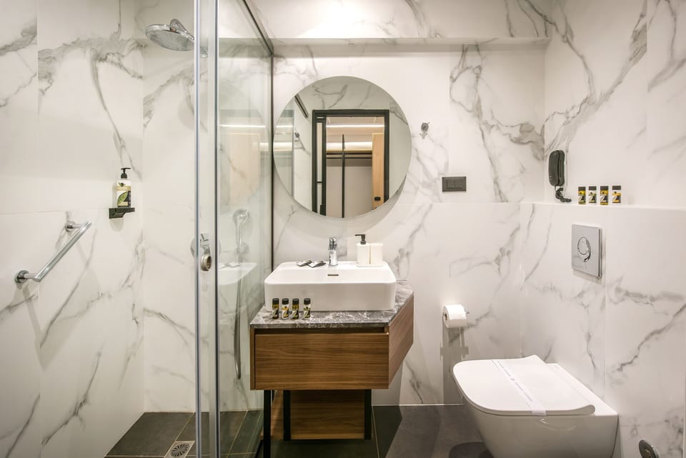 Shower, free toiletries, hair dryer, slippers