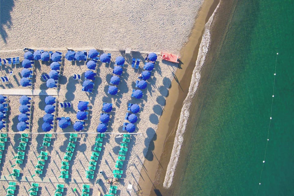 Private beach, white sand, sun loungers, beach umbrellas