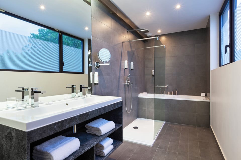 Combined shower/tub, hair dryer, towels, soap
