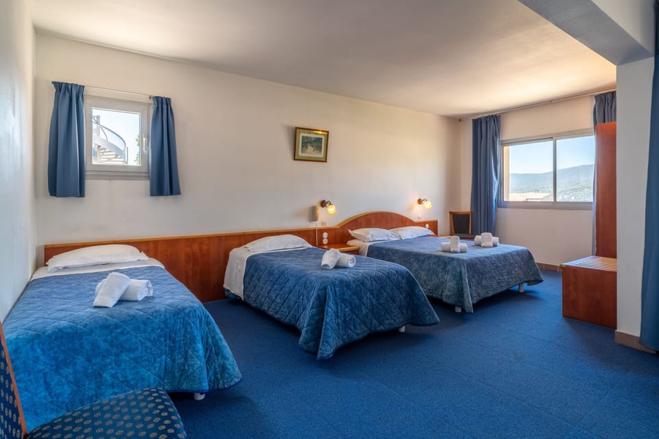 Quadruple Room, Sea View | Desk, rollaway beds, bed sheets
