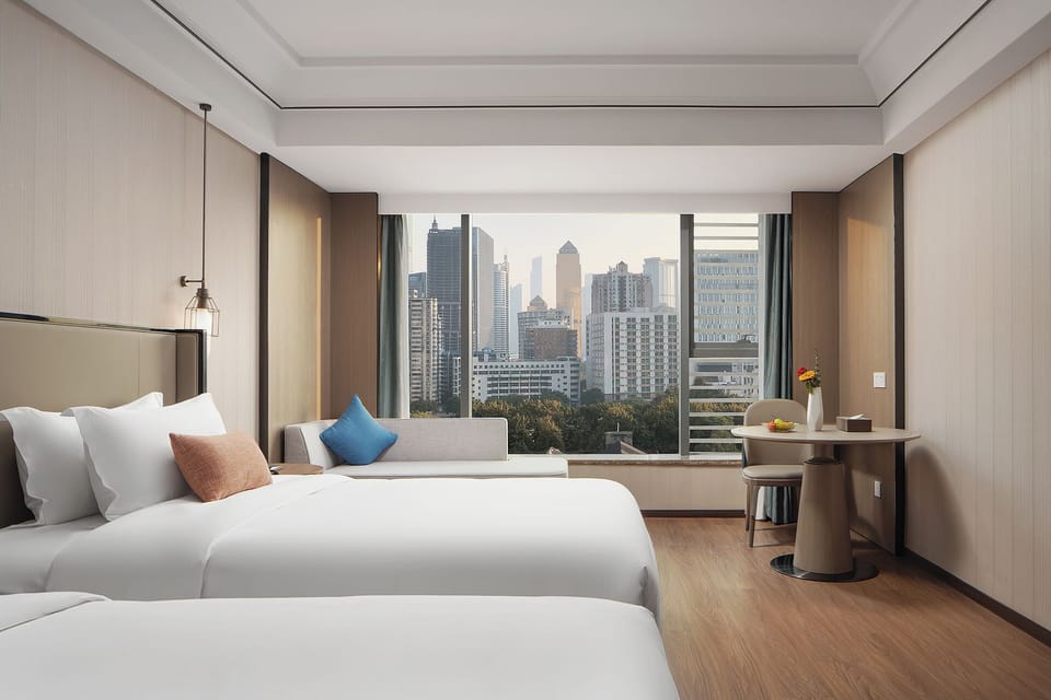 Executive Twin Room, City View | In-room safe, desk, laptop workspace, blackout drapes