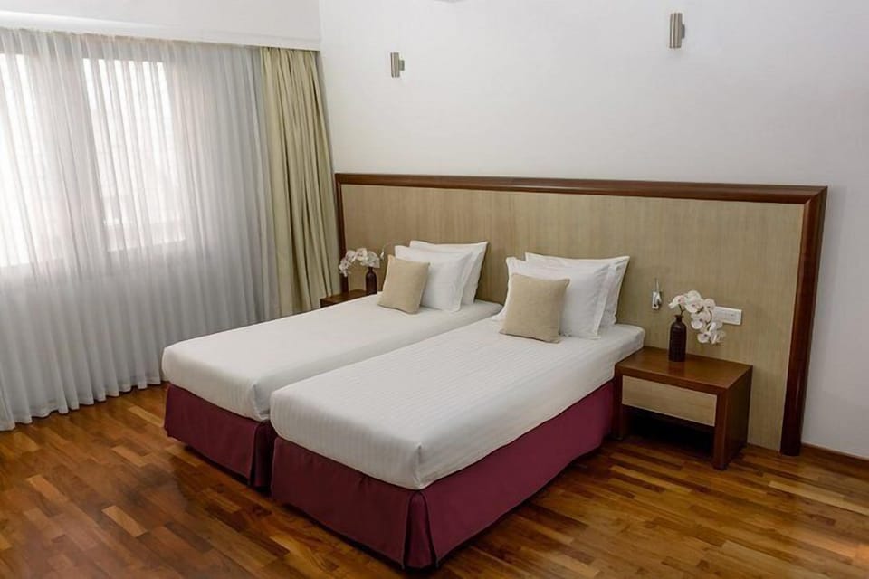 Double or Twin Room, City View | Blackout drapes, soundproofing, free WiFi