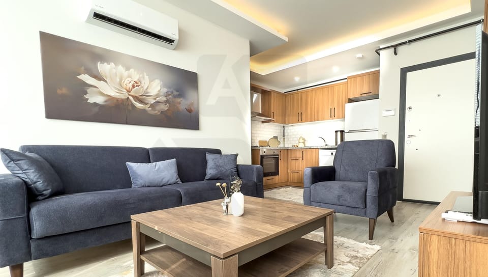 Deluxe Apartment, Balcony, City View | Living area | 120-inch TV with satellite channels