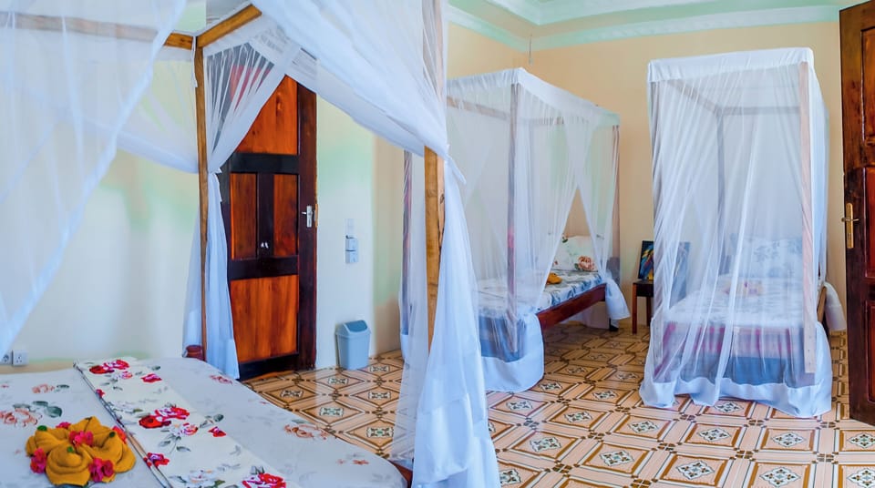 Family Quadruple Room, Balcony | Free WiFi, bed sheets