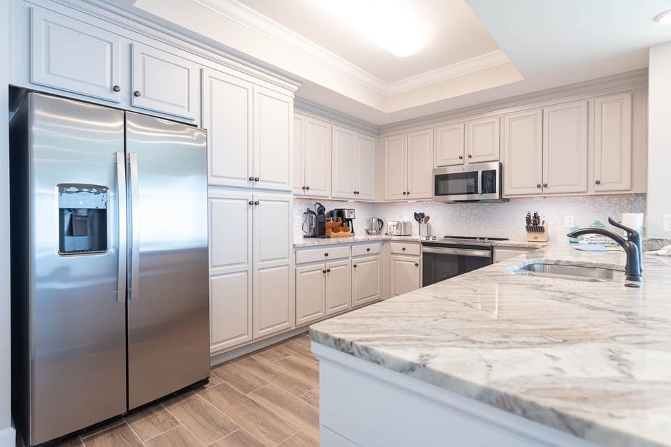 Condo, 4 Bedrooms | Private kitchen | Fridge, oven, coffee/tea maker