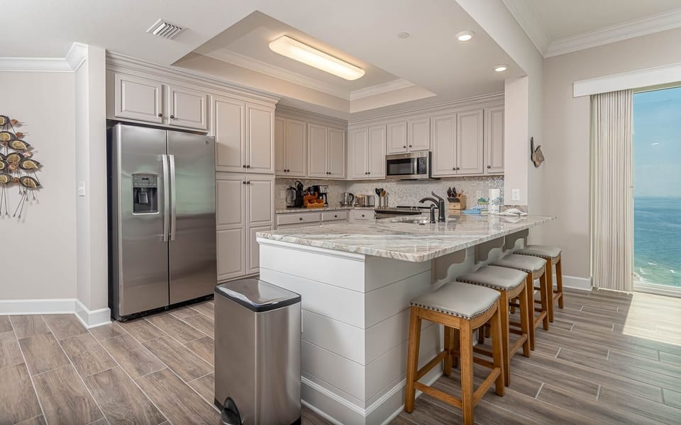 Condo, 4 Bedrooms | Private kitchen | Fridge, oven, coffee/tea maker