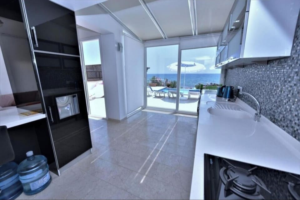 Villa | Private kitchen | Fridge, microwave, oven, stovetop