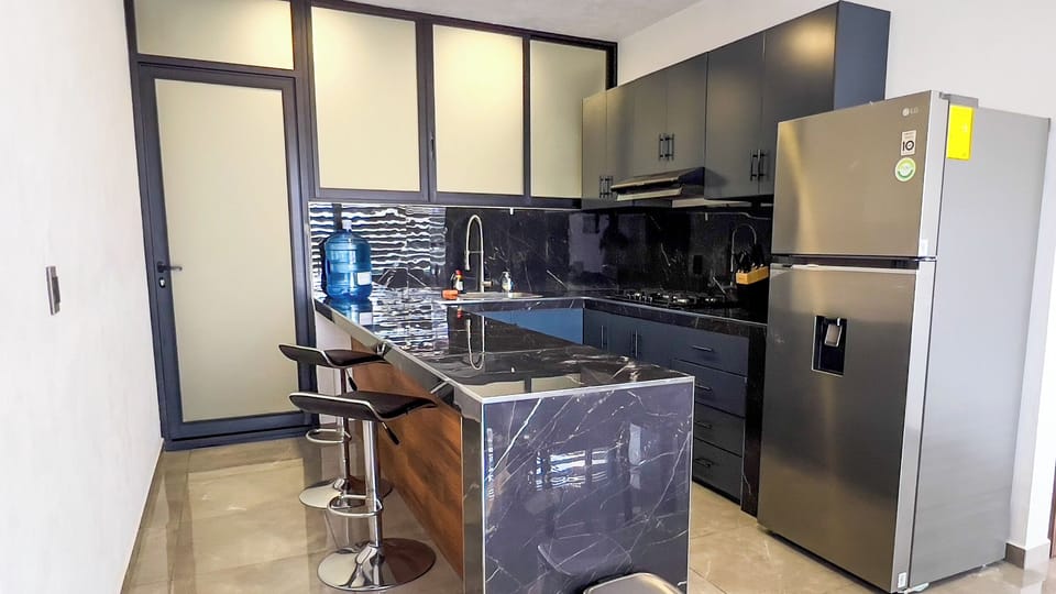 Superior Studio, 2 Bedrooms, City View | Private kitchen | Cookware/dishes/utensils, dining tables