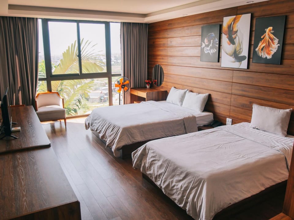 Family Room, Garden View | Minibar, desk, blackout drapes, free WiFi