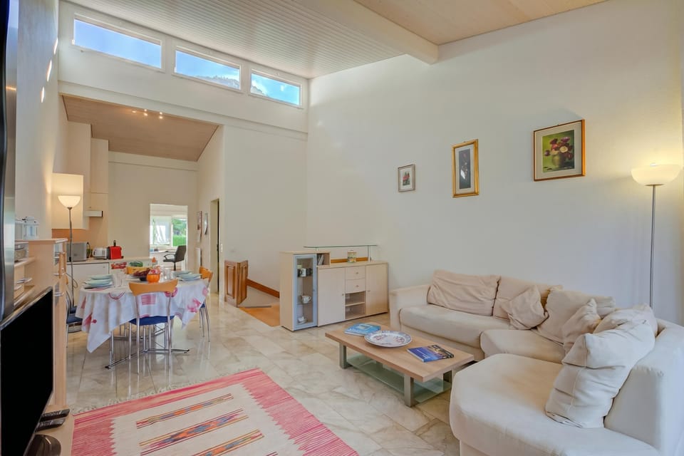 Family Apartment, 2 Bedrooms, 2 Bathrooms, Lakeside (Miralago Lakeview Morcote With Pool) | Living area | Flat-screen TV, stereo