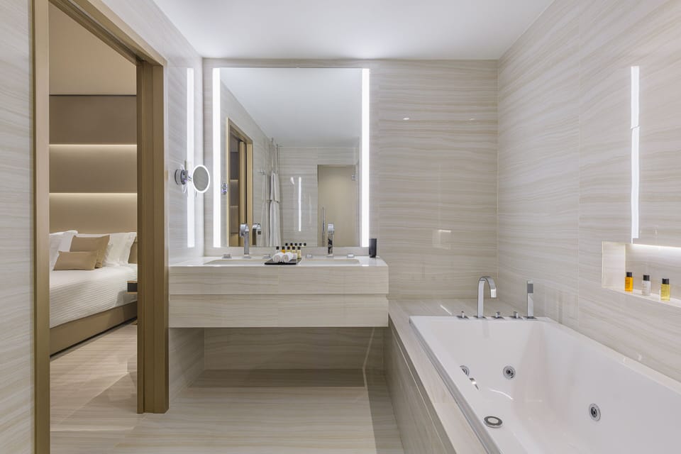 Suite, Sea View (Penthouse) | Bathroom | Combined shower/tub, free toiletries, hair dryer, bathrobes