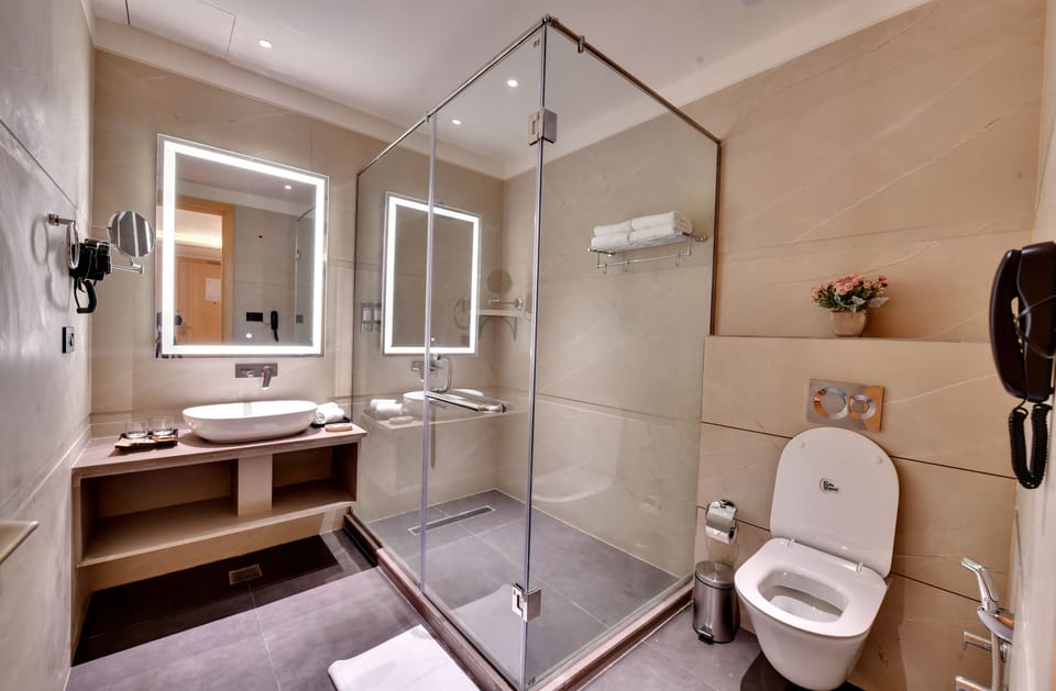 Shower, slippers, bidet, towels
