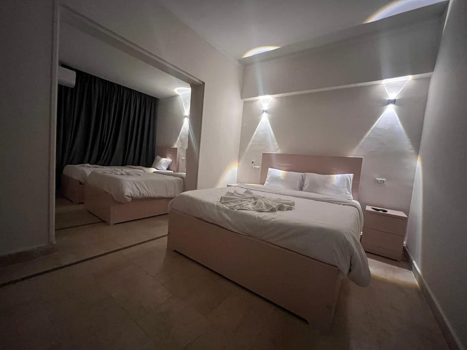 Family Quadruple Room, City View | Premium bedding, down comforters, minibar, soundproofing