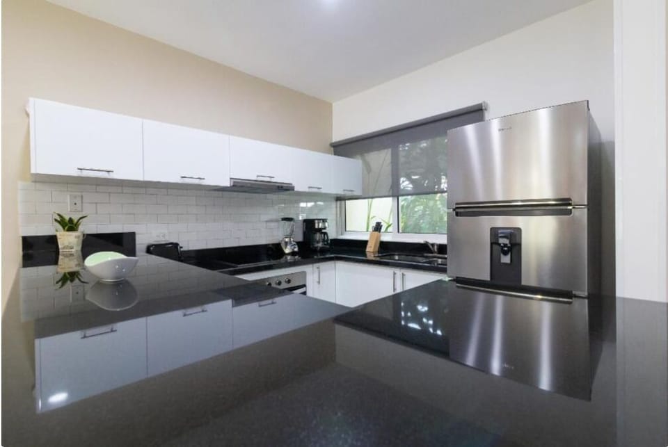 Full-size fridge, toaster, blender, cookware/dishes/utensils