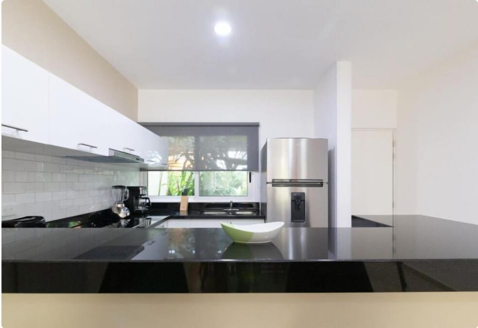 Full-size fridge, toaster, blender, cookware/dishes/utensils