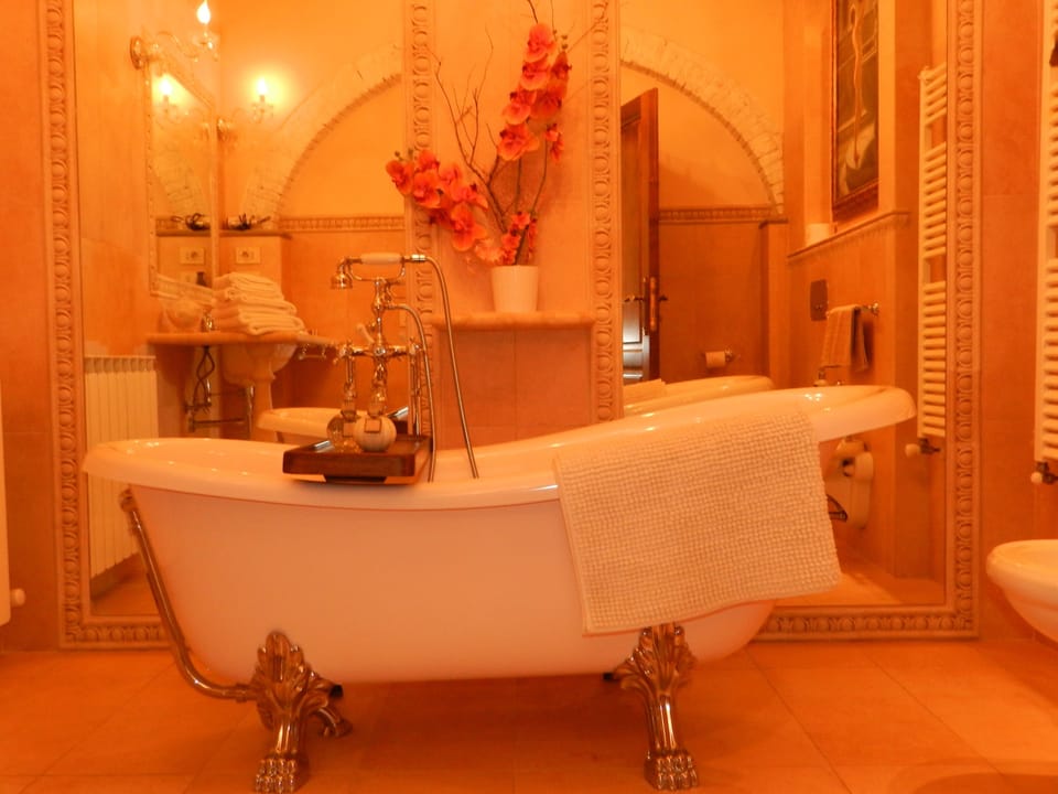 Family Room | Bathroom | Designer toiletries, hair dryer, bathrobes, slippers