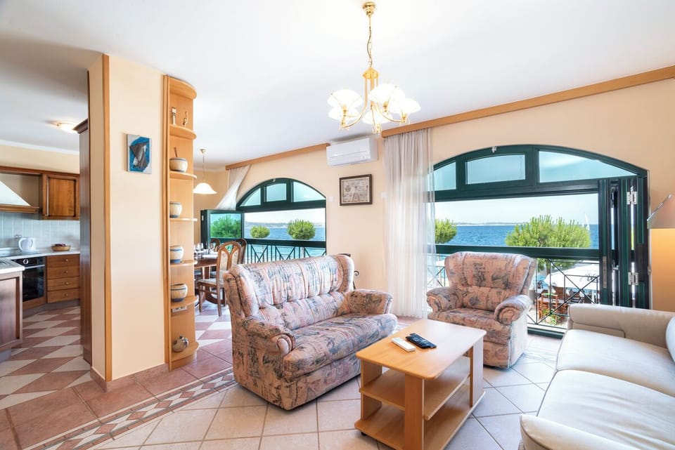 Classic Apartment, 2 Bedrooms, Sea View, Beachfront | Living area | Flat-screen TV