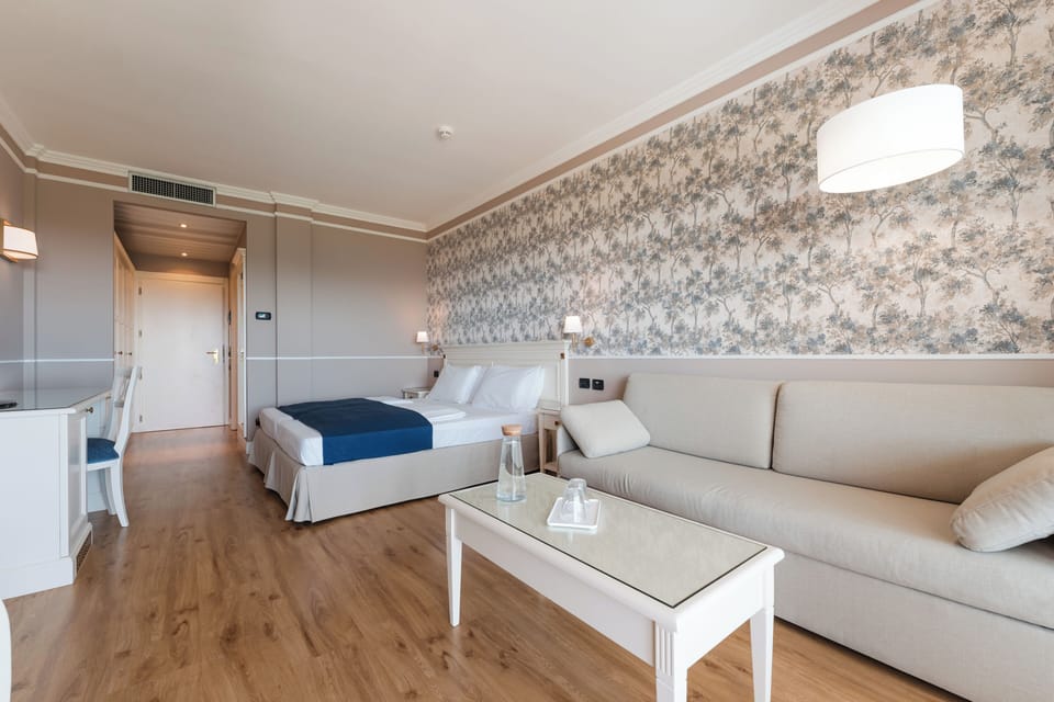 Junior Suite, 1 Bedroom, Non Smoking, Lake View | Down comforters, minibar, in-room safe, desk