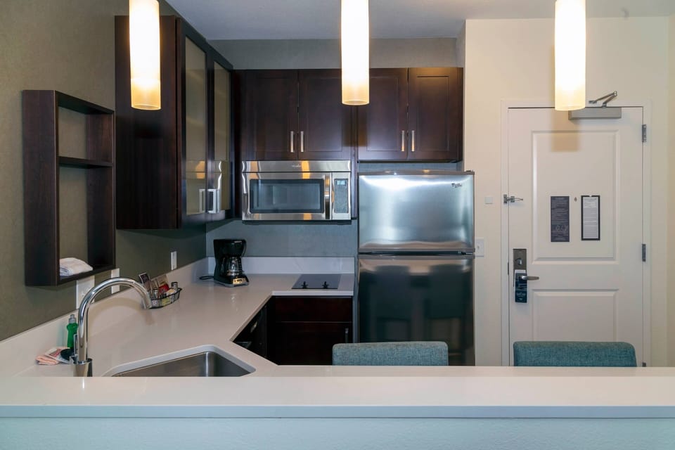 Studio, 1 King Bed | Private kitchen | Full-size fridge, microwave, stovetop, dishwasher