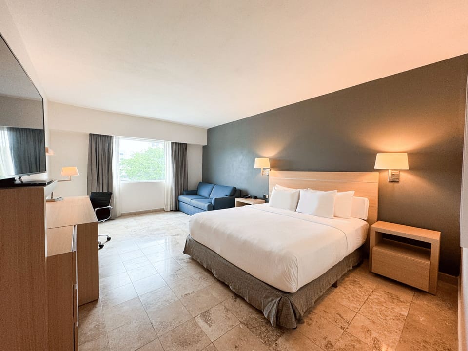 Deluxe Room, 1 King Bed with Sofa bed | Premium bedding, in-room safe, desk, laptop workspace