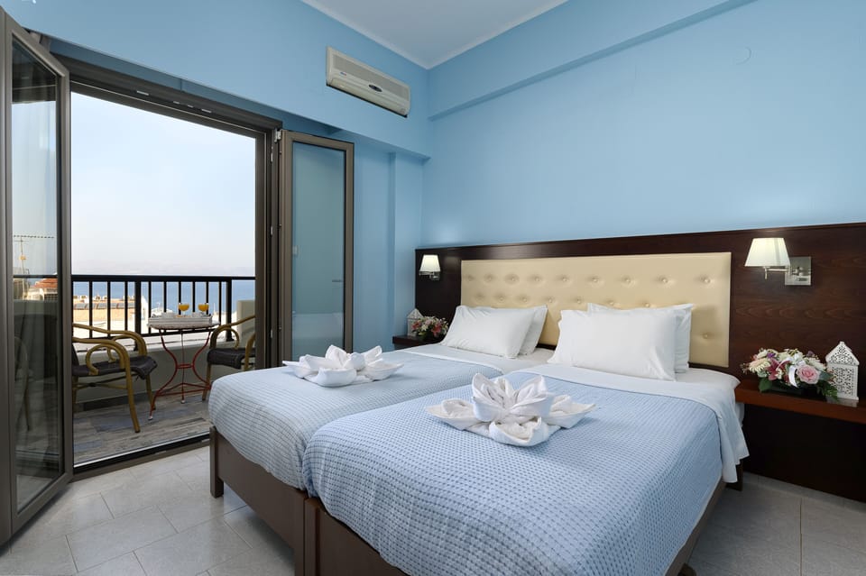 Double or Twin Room, Sea View | Minibar, in-room safe, individually furnished, desk