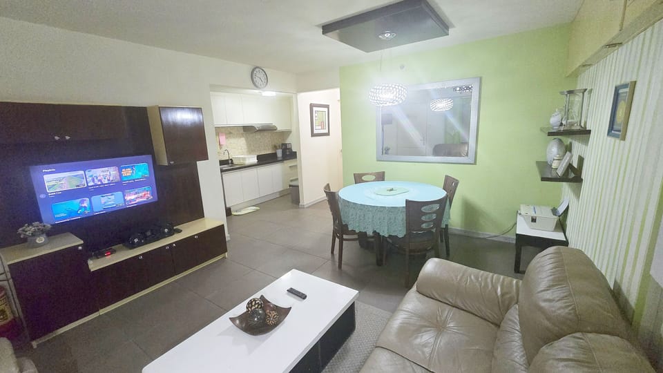 Luxury Condo, 2 Bedrooms, Balcony, Garden View | Living area | 40-inch LCD TV with digital channels, printers