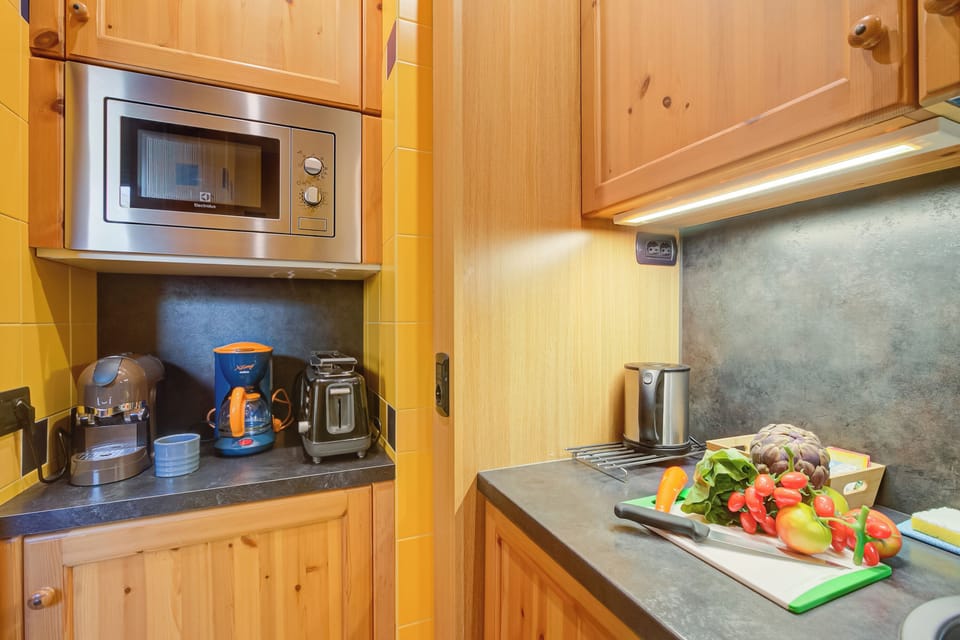Family Apartment, Multiple Bedrooms (Giglio) | Private kitchen | Microwave, stovetop, coffee/tea maker, electric kettle