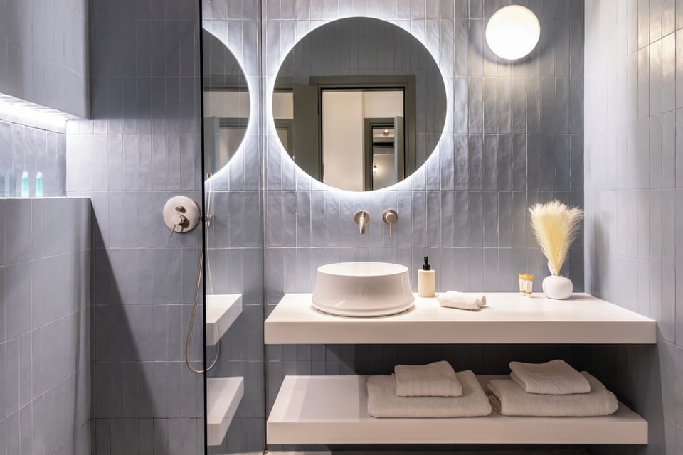 Superior Suite, City View | Bathroom | Shower, hair dryer, bathrobes, slippers