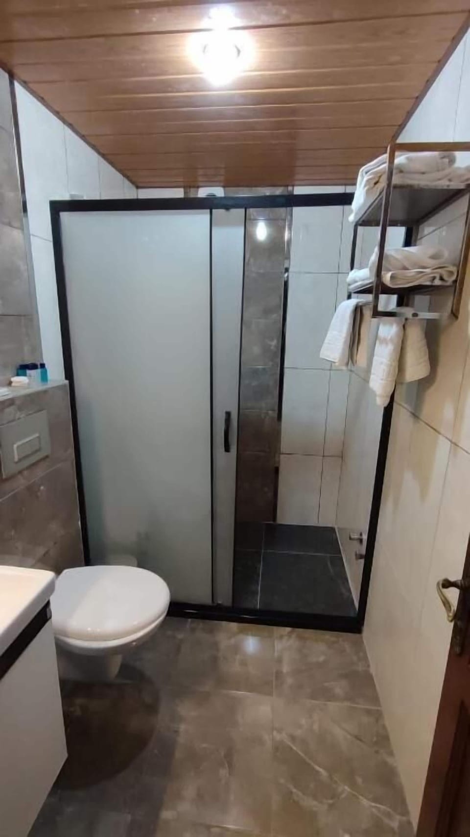 Shower, hair dryer, slippers, towels