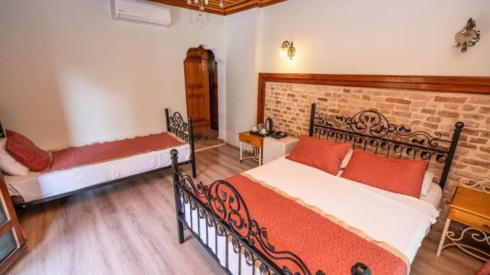 Family Triple Room, Balcony, City View | Minibar, laptop workspace, free WiFi, bed sheets
